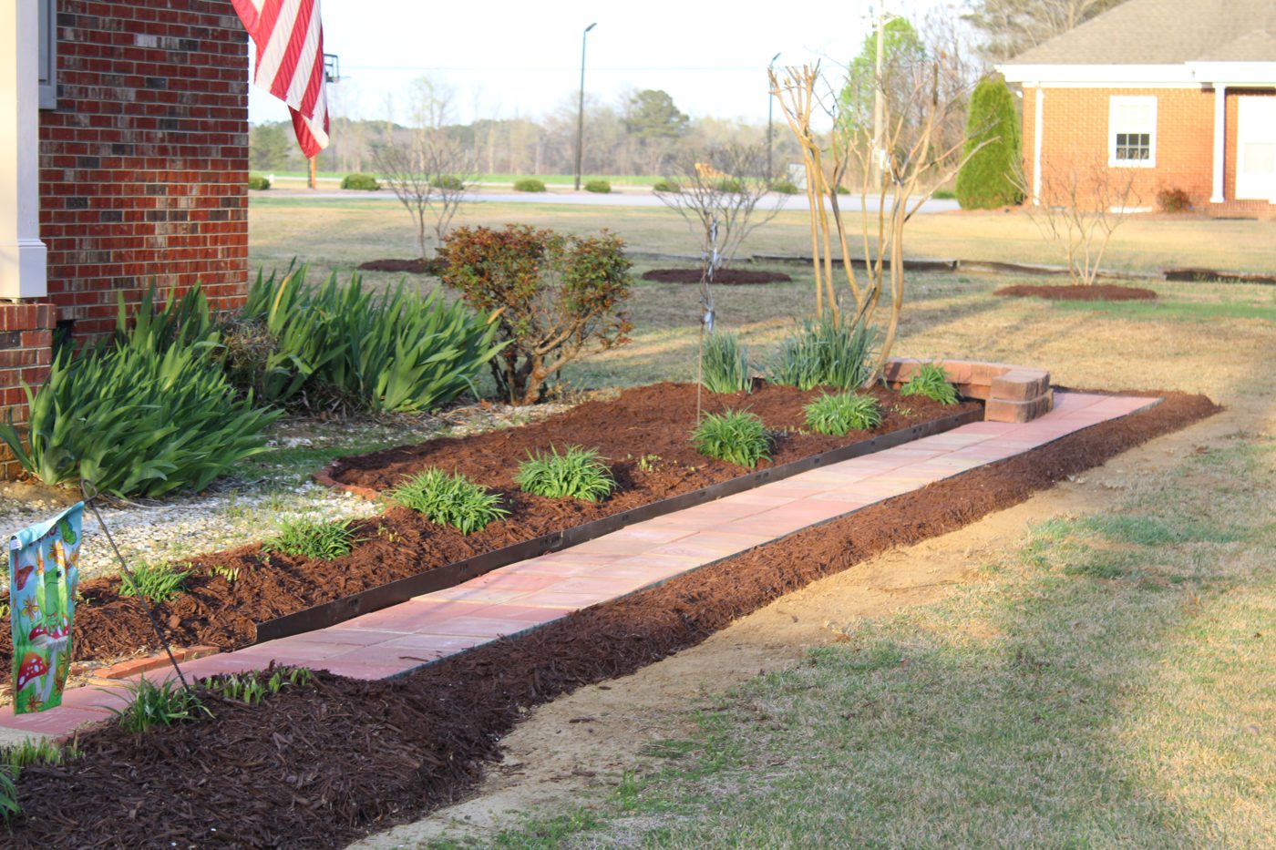 Mulch bed with brick edging